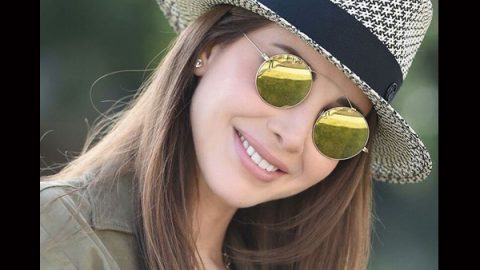 نانسي عجرم بتسريحة شعر إنسيابية مع قبعة